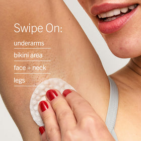 First Aid Beauty pads arranged with other skincare items showing compatibility in a skincare routine