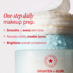 First Aid Beauty pad held in hand demonstrating easy, pre-soaked convenience