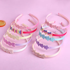 Fishdown flat lay of ten headbands showing variety and gift-ready convenience benefit