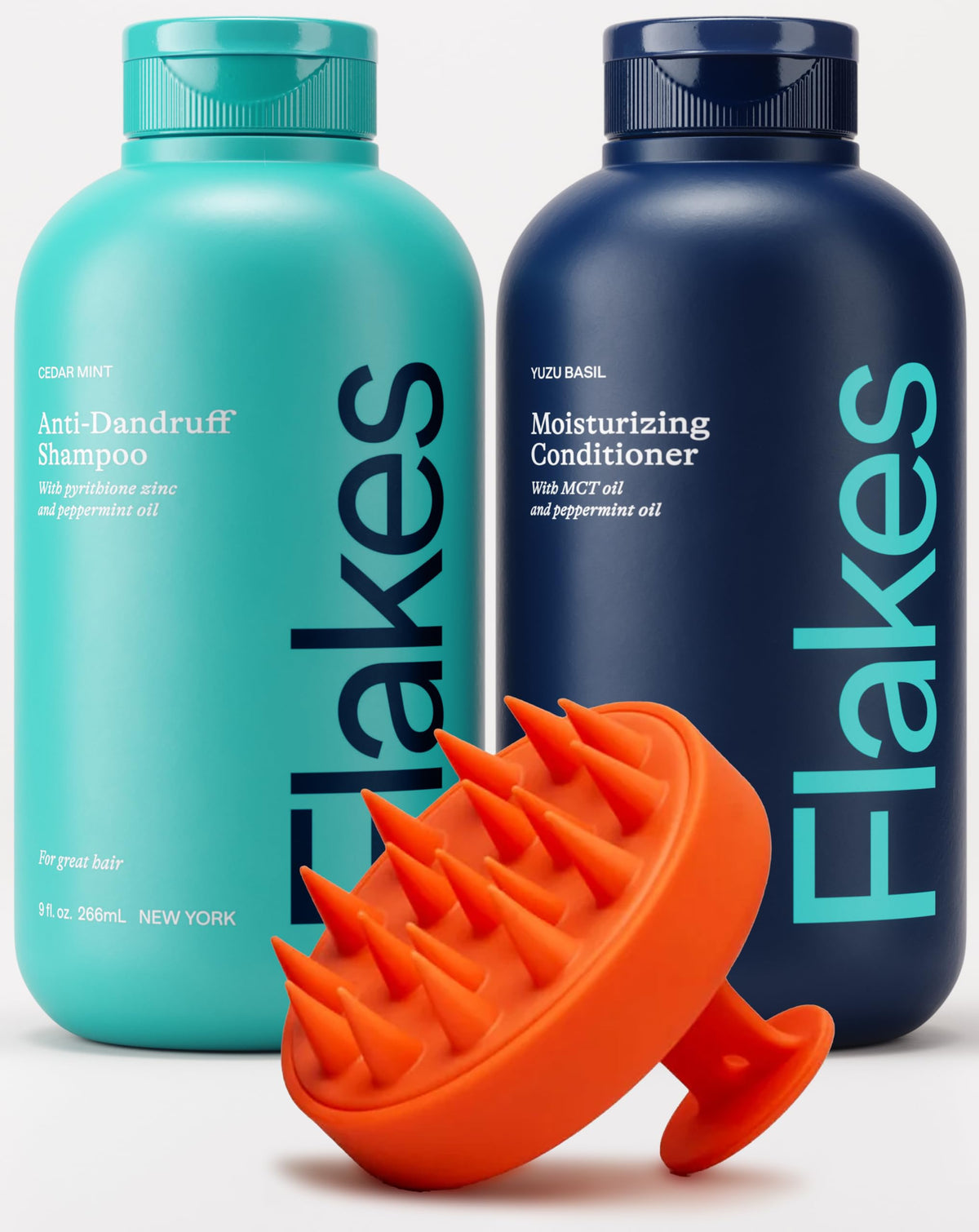 Flakes front packaging showing bottles and scalp brush with clear product benefits