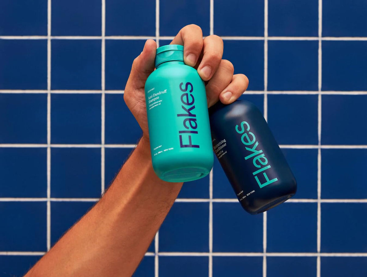 Flakes set in shower use with man applying shampoo for effective flake removal
