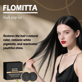Flomitta bar next to hand for scale showing compact travel-friendly size