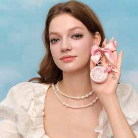 Flower Knows keychain cap clipped to a purse offering quick access benefit