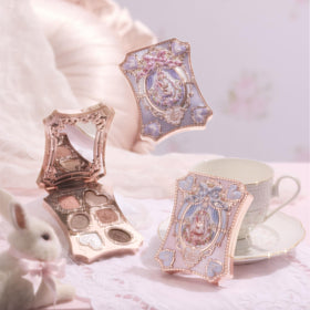 Flower Knows palette in hand to show palm-sized scale and travel-friendly compact convenience