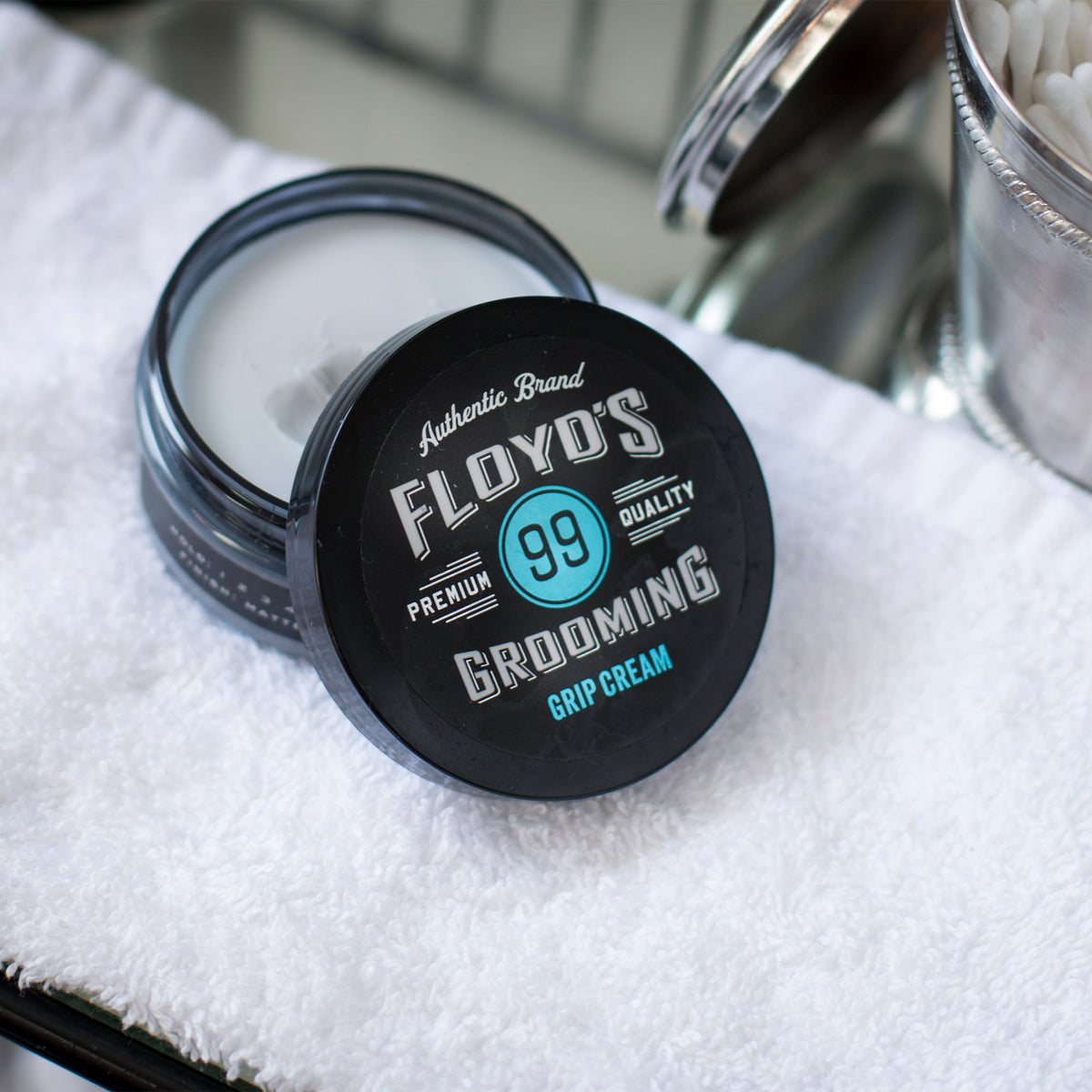 Floyd's 99 cream on hand being scooped for quick application and control