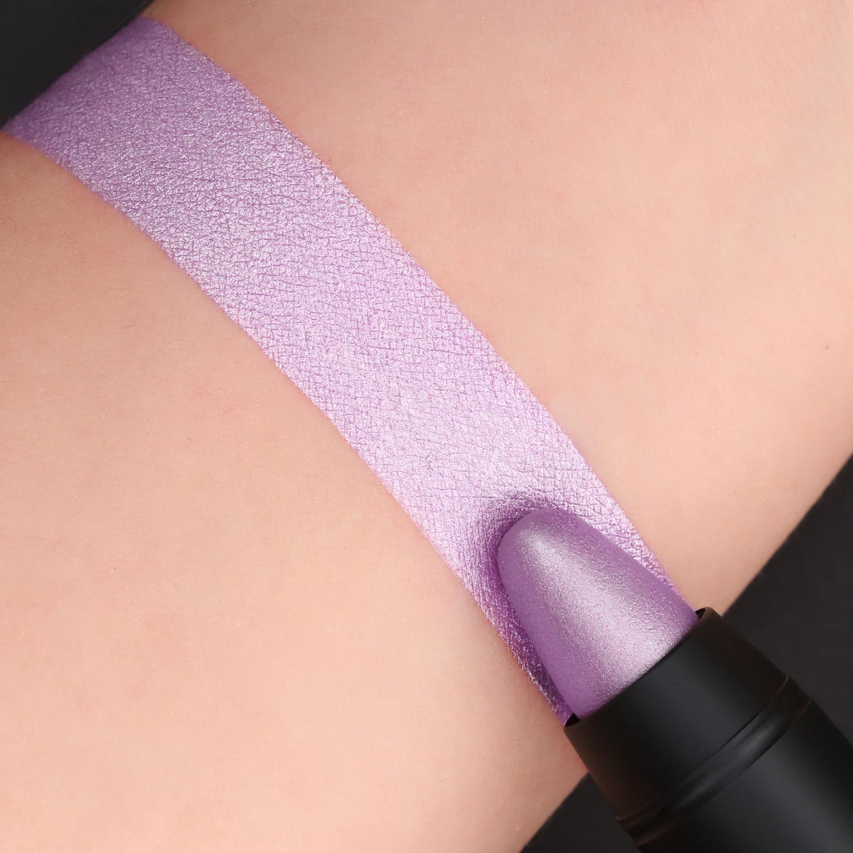 FOCALLURE lip crayon held in hand showing compact size and portability