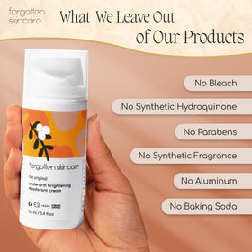 Forgotten Skincare next to hands to show product size and portability