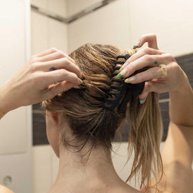 FRAMAR bun hairstyle in lifestyle scene showing comfortable all-day wear