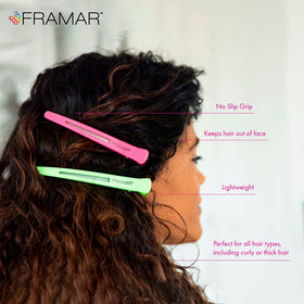 FRAMAR clip securing hair during styling, keeping sections steady and crease-free