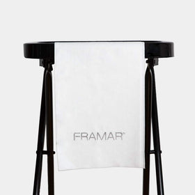 FRAMAR towel held by hand demonstrating size and lightweight feel