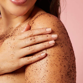 frank body scrub on bathroom counter in lifestyle setting suggesting daily use