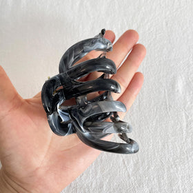 FRDTLUTHW held in hand to show scale and lightweight 1.51oz feel