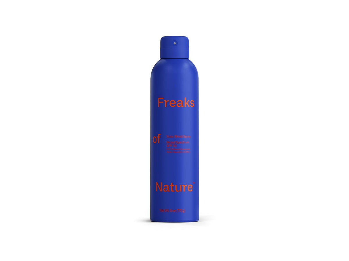 Freaks of Nature spray in use on beach showing reef-safe protection for outdoors