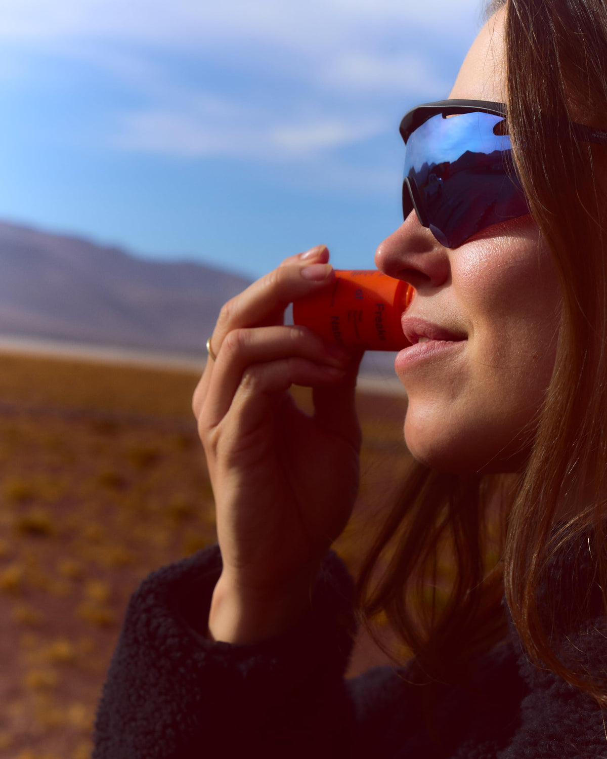 Freaks of Nature sun stick applied during outdoor activity demonstrating sweat and water resistance