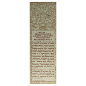 Fresh kombucha essence scale next to ruler showing compact 1.6 oz travel-friendly size