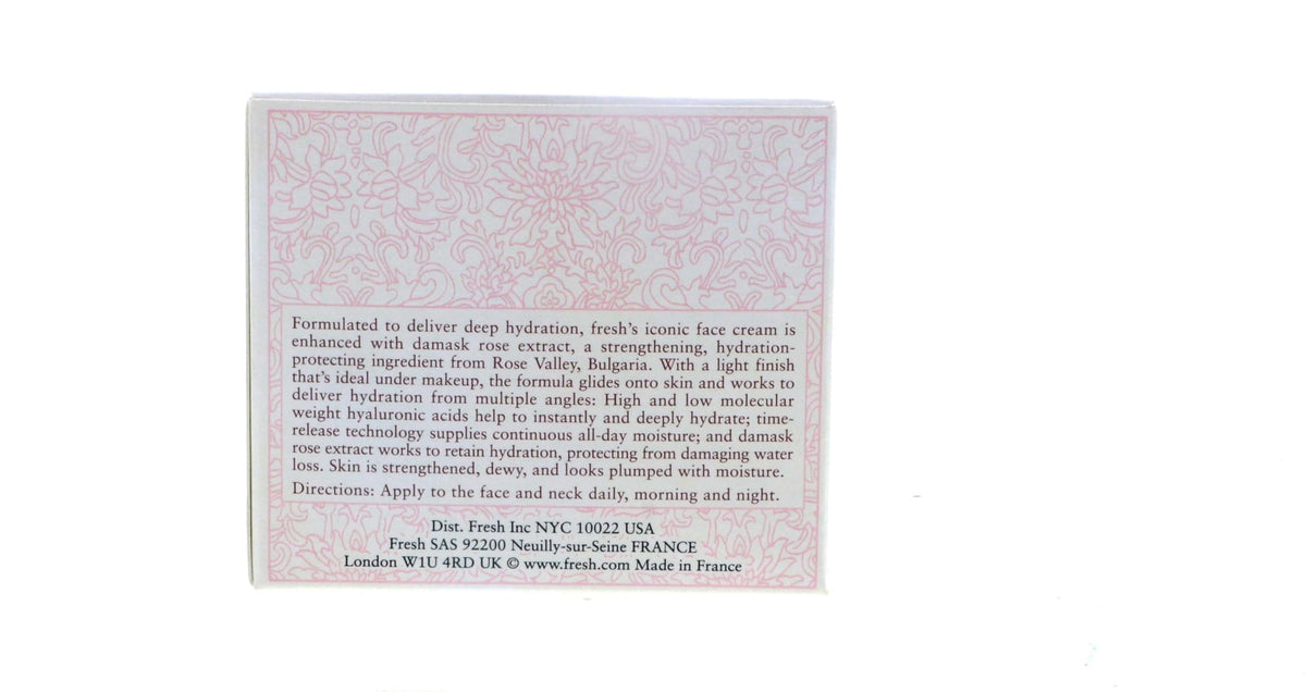 Fresh rosewater and petals beside jar showing botanical ingredients and soothing benefits