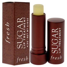 Fresh sugar lip treatment in hand for size comparison and portability