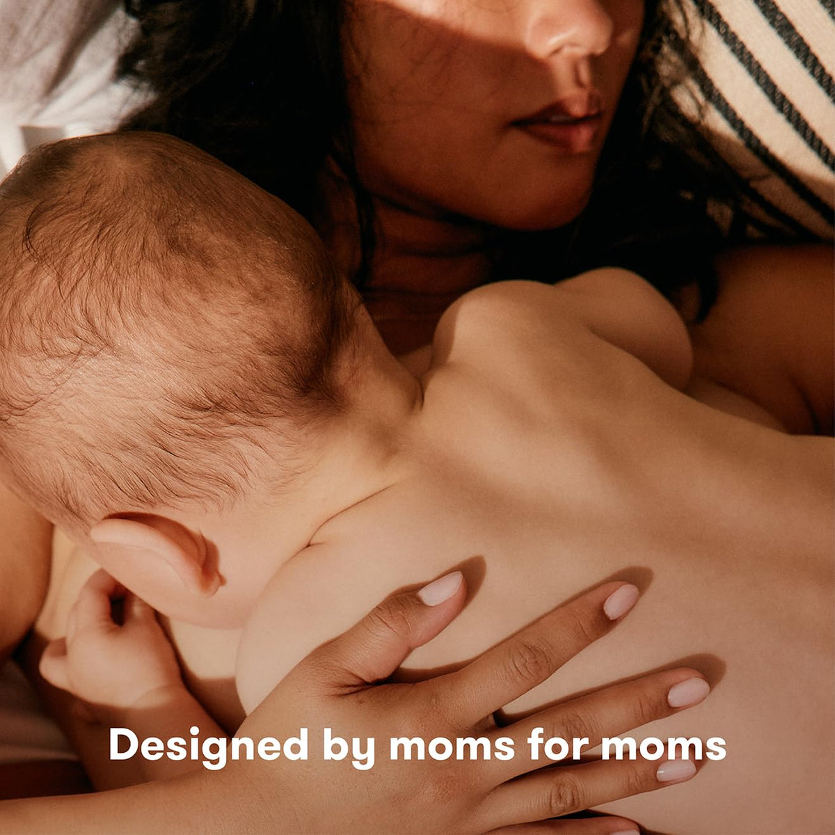 Frida Mom spray in postpartum bathroom setting supporting comfort