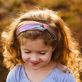 FROG SAC headband worn on a child side profile demonstrating secure fit and hair kept away from face