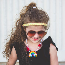 FROG SAC tie dye headbands in an Easter basket as a cheerful gift idea