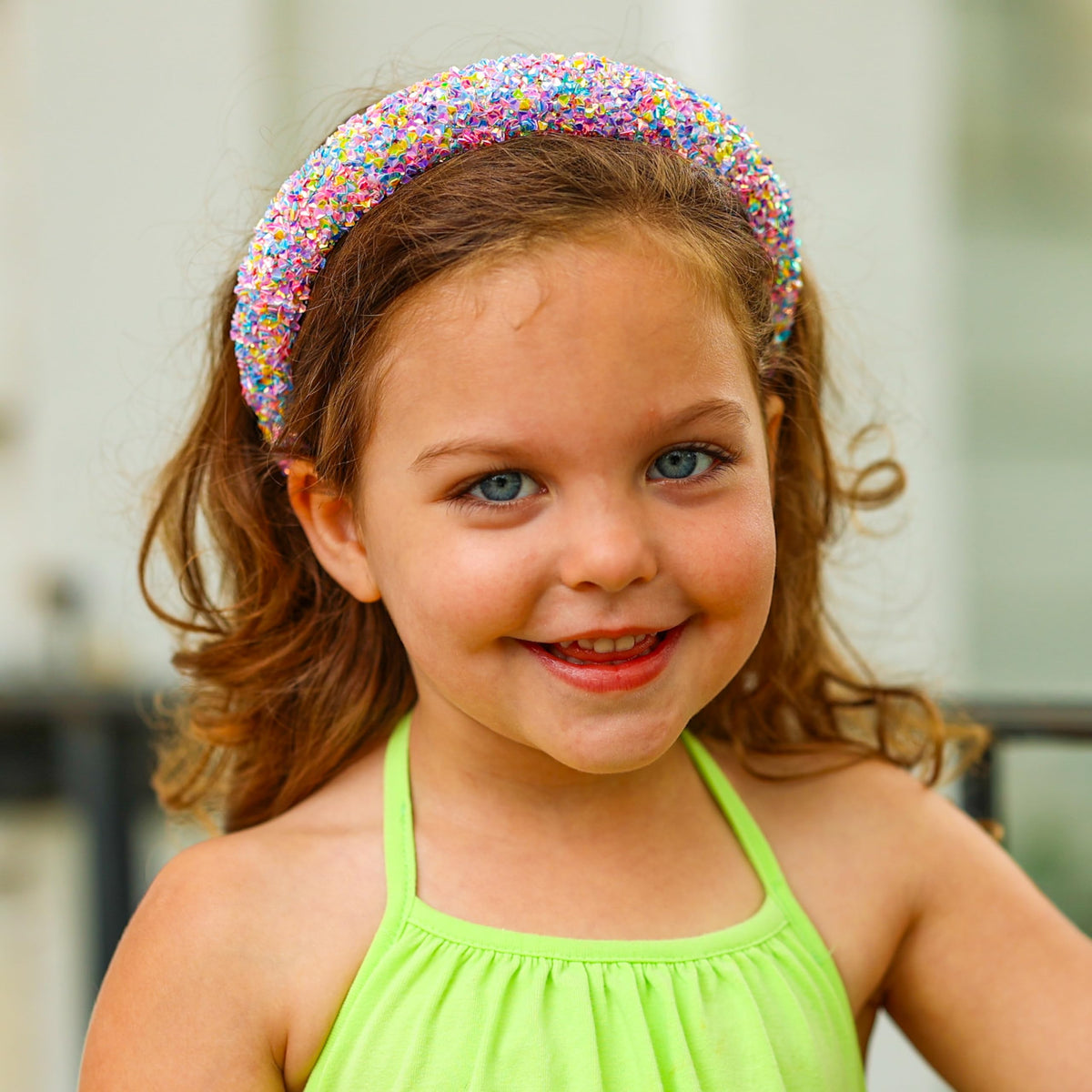 FROG SAC child wearing headband outdoors showing festive sparkle and everyday durability