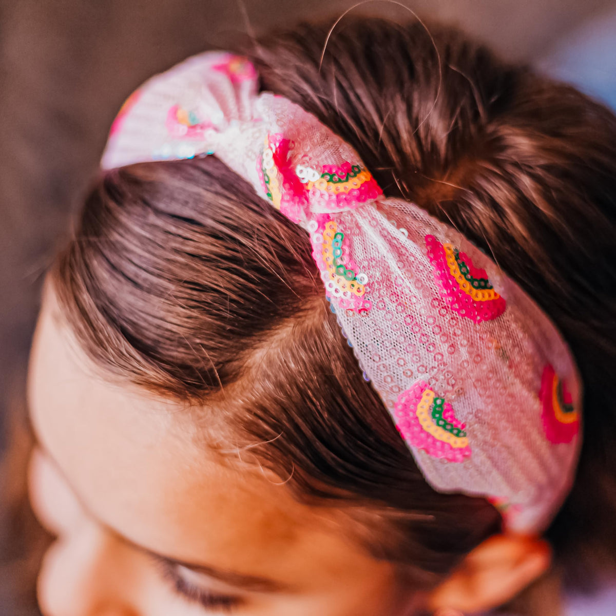 FROG SAC two kids playing while wearing headbands showing active hold benefit