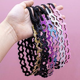FROG SAC headbands next to measuring tape to show 17–21 inch fit
