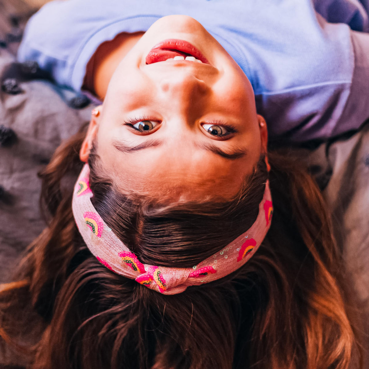 FROG SAC headband next to ruler illustrating 13-inch youth sizing benefit