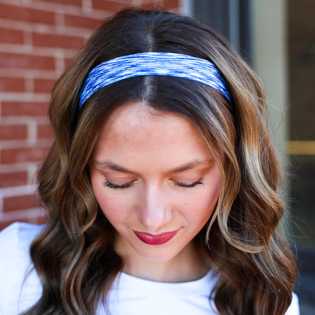 Ruler beside FROG SAC headband to show size range and fit flexibility