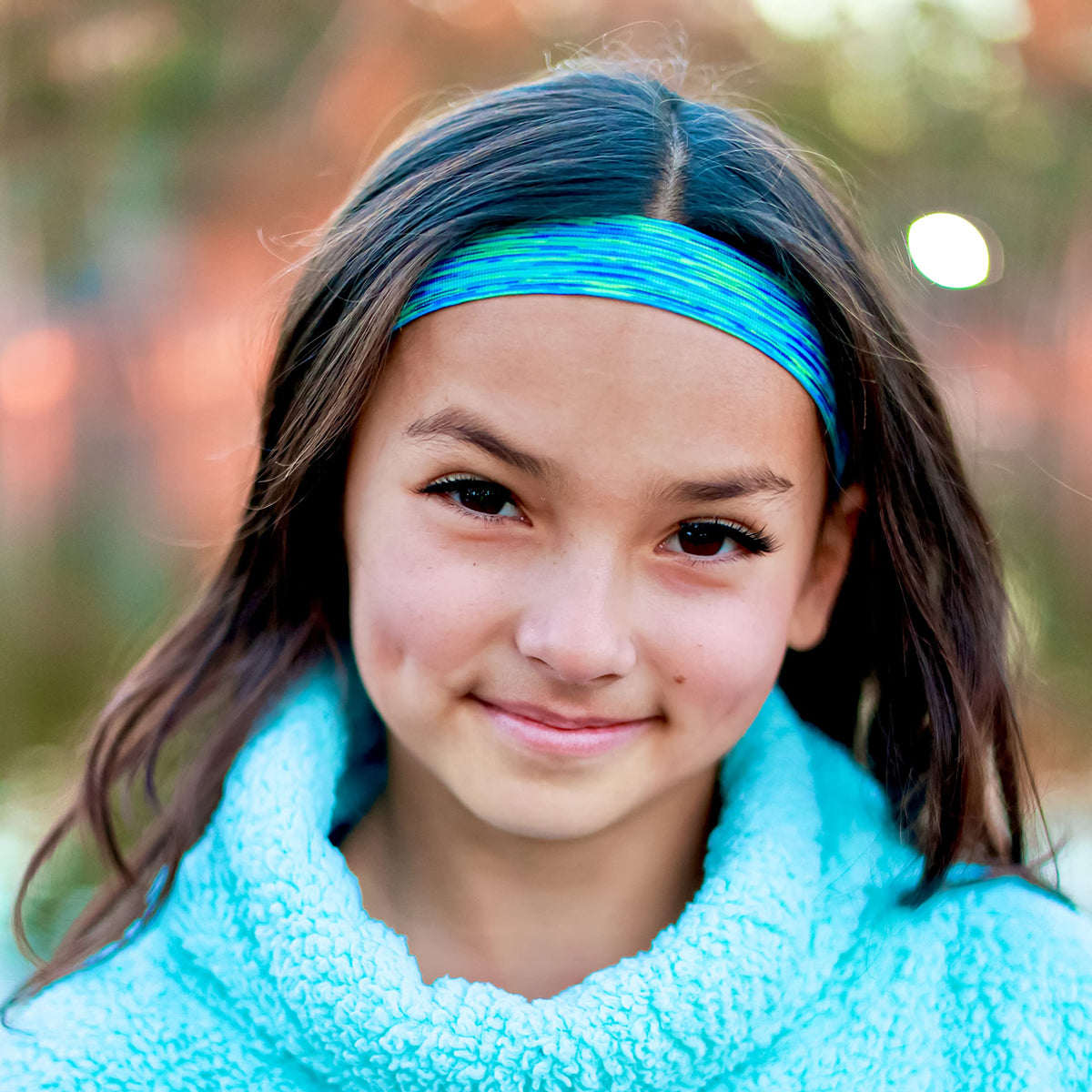 FROG SAC headband worn with ponytail showing no-bulge comfort and tidy look