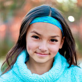 FROG SAC headband worn with ponytail showing no-bulge comfort and tidy look