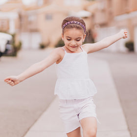 FROG SAC child wearing headband during play, demonstrating secure stay