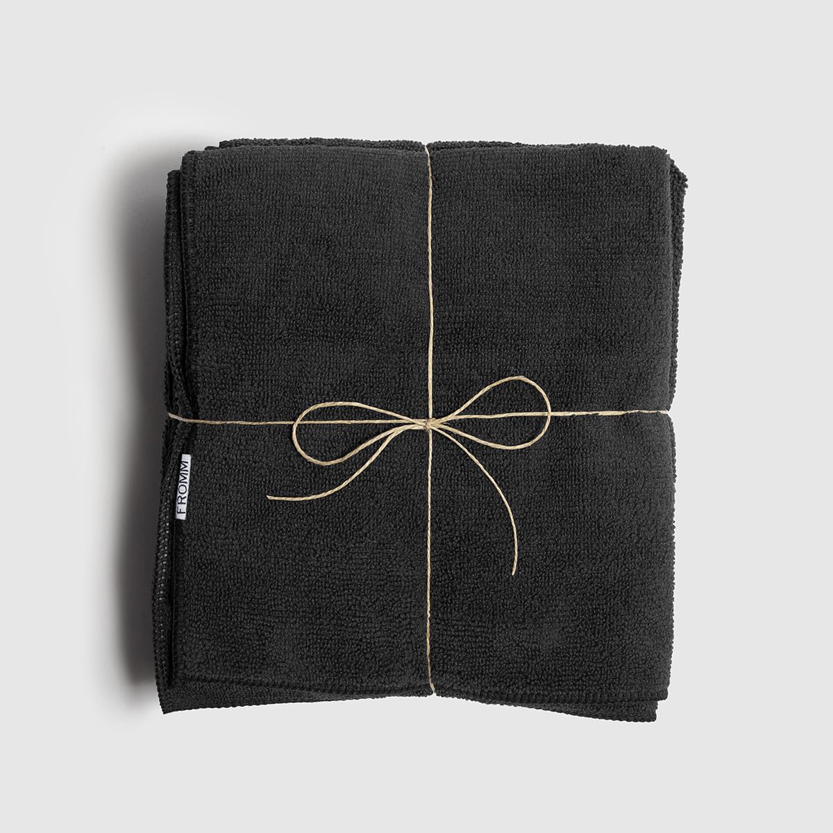 Fromm stacked folded towels in a shelf showing durable salon-ready set