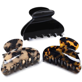 Fsmiling front view of three tortoise and leopard clips shows stylish pack and versatility