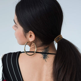 Funtopia hair ties in a gym bag showing portable styling and workout readiness