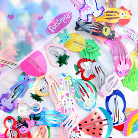 Funtopia clips next to ruler showing compact size and portability