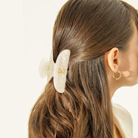 Fycert hair clip worn in a bun on model demonstrating secure hold and style