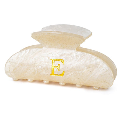 Fycert gold monogram hair clip front view showing elegant finish and secure hold