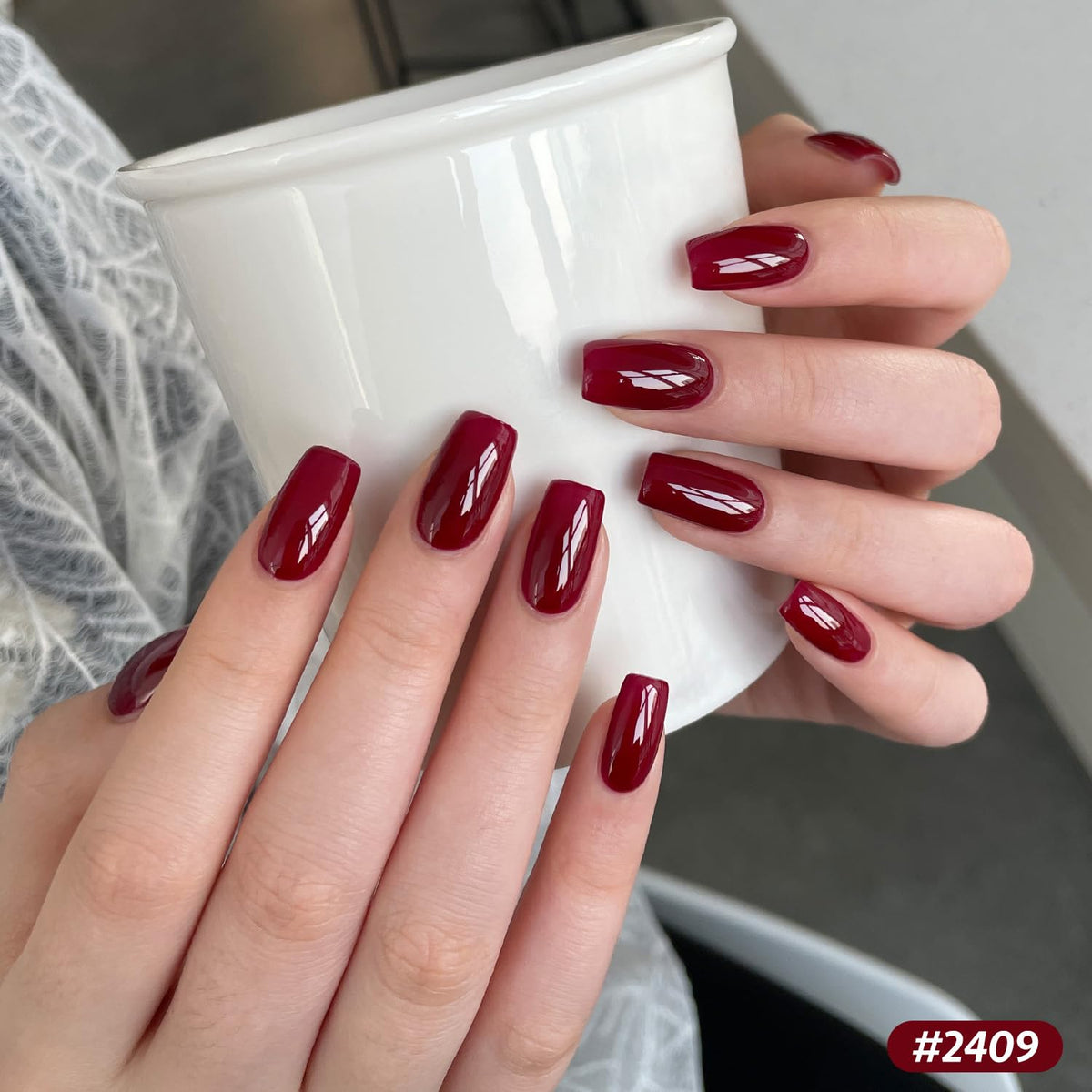 GAOY swatch fan on fingers displaying color range and wearable berry tones