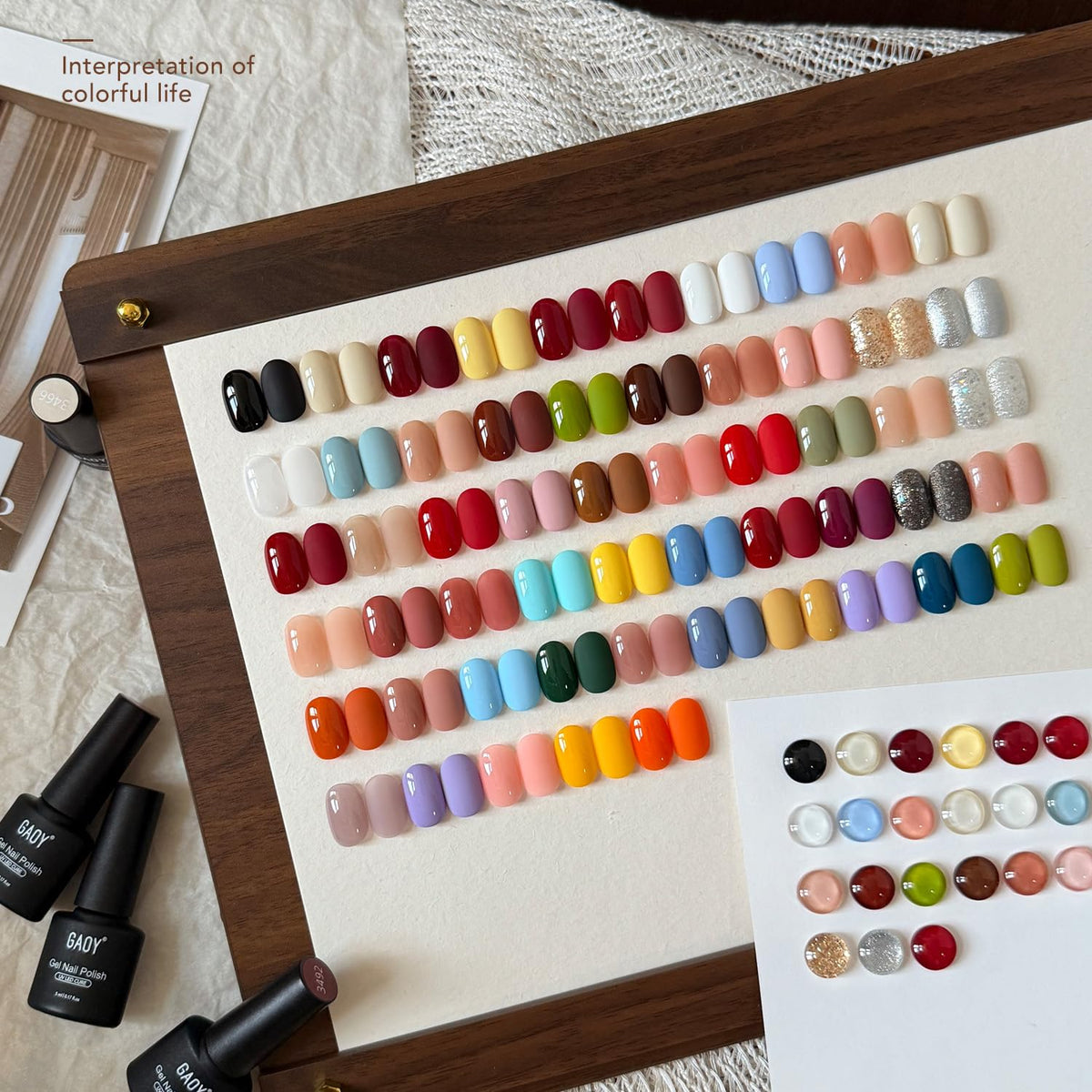 GAOY color swatches flatlay highlighting 55 seasonal shades for versatile looks