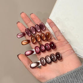 GAOY magnet held above nail swatches demonstrating cat eye band for precise effects