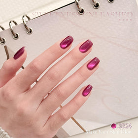 GAOY cat-eye magnet held over wet polish creating magnetic stripe effect for dramatic nails