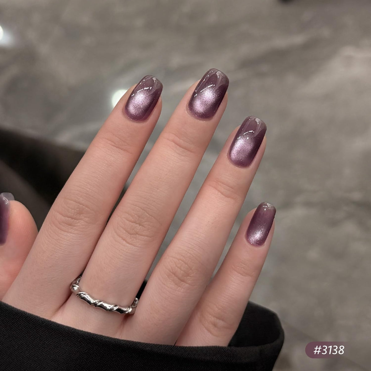 GAOY magnet held above a nail showing cat eye formation for precise designer shimmer