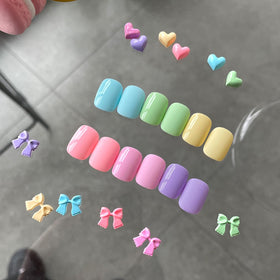 GAOY bottles next to a hand for scale showing kit portability and travel-friendly size