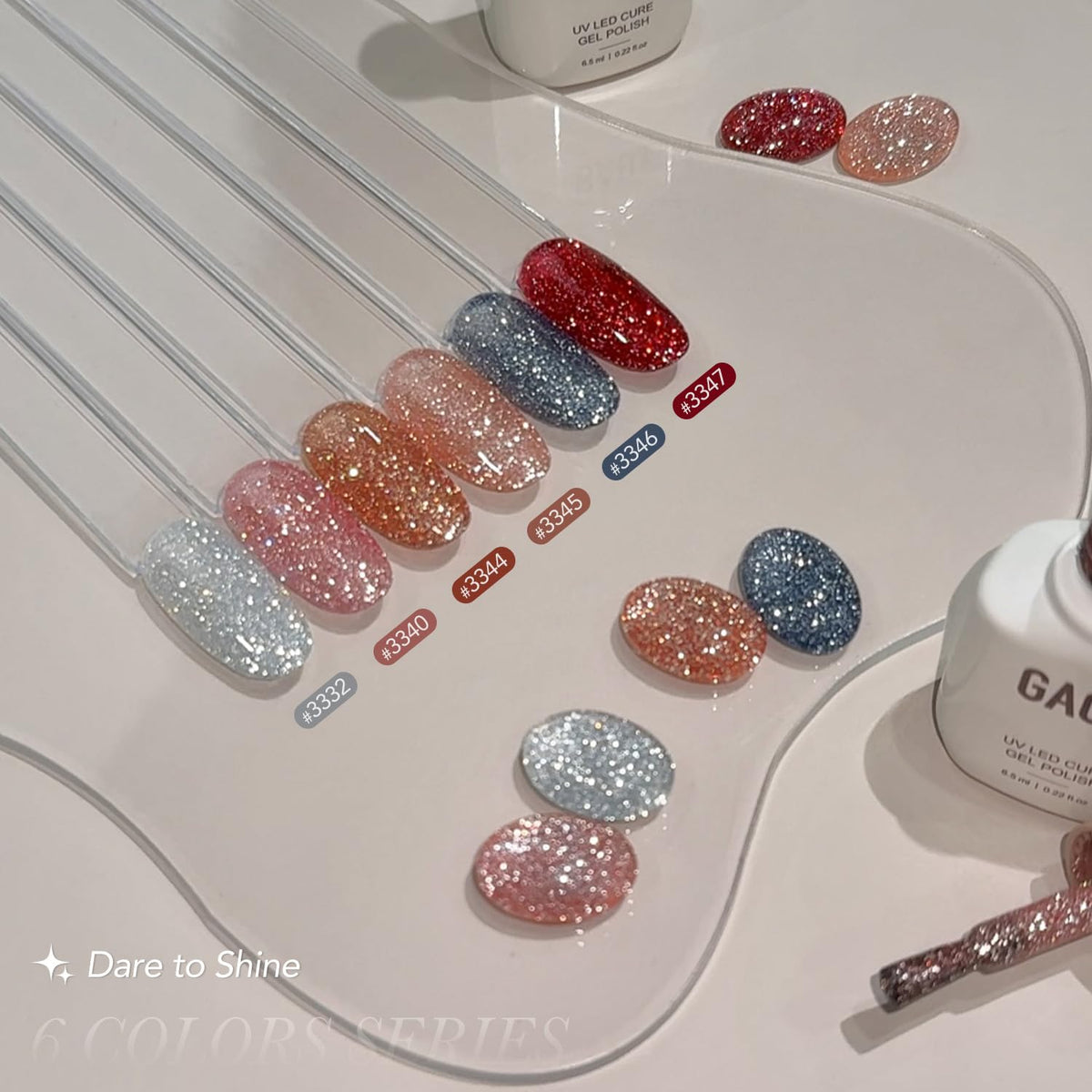 GAOY bottles beside a hand for scale to show 6.5ml travel-friendly size and portability