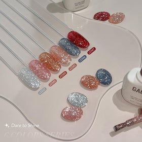 GAOY bottles beside a hand for scale to show 6.5ml travel-friendly size and portability