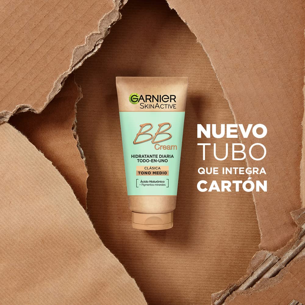 Garnier tube next to hand showing 50 ml travel-friendly benefit