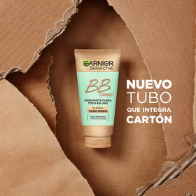 Garnier tube next to hand showing 50 ml travel-friendly benefit