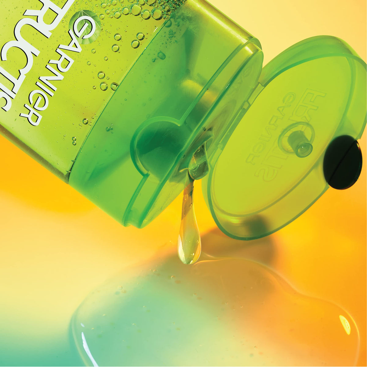 Garnier Fructis bottle next to ruler illustrating 33.8 fl oz scale and value