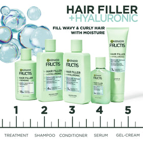 Garnier Fructis applied to curly hair in shower for smoother, defined curls